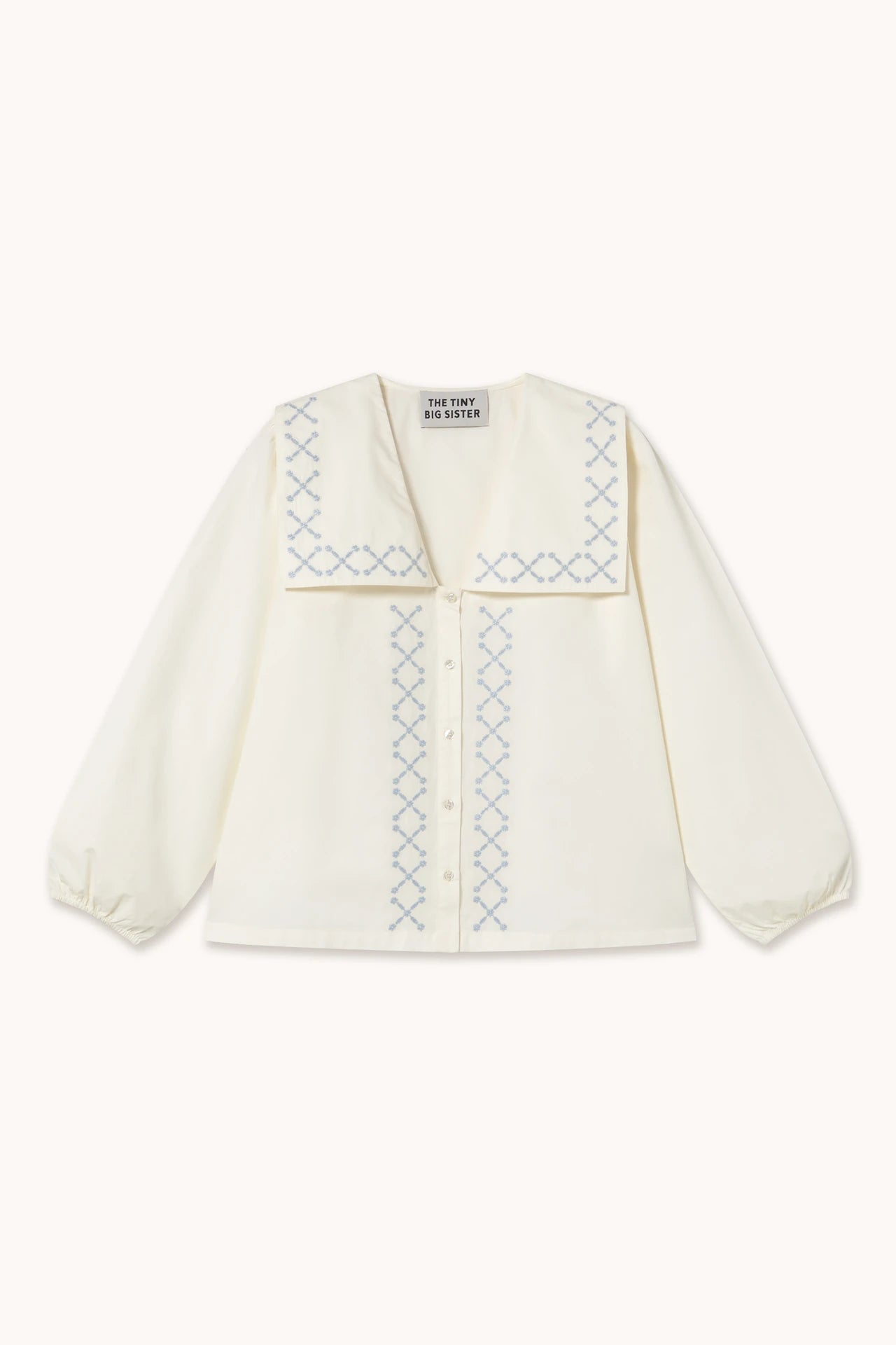 the tiny big sister cross flower embroidered blouse